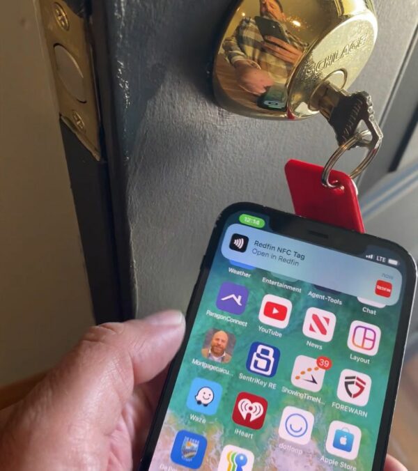 Tapping a phone against a NFC Keychain
